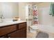 Cozy bathroom featuring a vanity, toilet, and shower/tub combination at 474 Boxelder Rd, Atlanta, GA 30349
