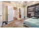 A primary bedroom featuring a door to the bathroom and carpeted floors at 474 Boxelder Rd, Atlanta, GA 30349