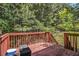 Wooden deck overlooking lush greenery, perfect for outdoor entertaining at 474 Boxelder Rd, Atlanta, GA 30349