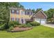 Charming two-story home featuring a landscaped yard and a two-car garage, perfect for Gathering living at 474 Boxelder Rd, Atlanta, GA 30349