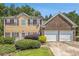 Lovely home with a combination of siding and brickwork and with a well maintained lawn and landscaping at 474 Boxelder Rd, Atlanta, GA 30349