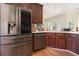 Kitchen featuring stainless steel appliances, hardwood floors, and a breakfast bar at 474 Boxelder Rd, Atlanta, GA 30349