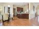 A kitchen and breakfast nook with hardwood floors and dark brown cabinetry at 474 Boxelder Rd, Atlanta, GA 30349