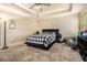 Bedroom featuring tray ceilings, carpet, and a ceiling fan at 474 Boxelder Rd, Atlanta, GA 30349
