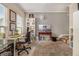 Bright and functional office space featuring a desk area with natural light and shelving for organization at 474 Boxelder Rd, Atlanta, GA 30349