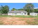 Spacious backyard with large detached storage shed and ample open space at 75 Plantation Ln, Locust Grove, GA 30248