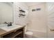 Well-lit bathroom showcasing shiplap walls, open shelving, and a shower-tub combo at 75 Plantation Ln, Locust Grove, GA 30248