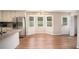 Eat-in kitchen features stainless appliances, granite counters and lots of light at 75 Plantation Ln, Locust Grove, GA 30248