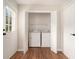 Bright laundry room features folding doors, storage, and natural light at 75 Plantation Ln, Locust Grove, GA 30248