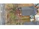 Aerial view of a home with a large backyard, storage shed, driveway, and landscaping at 1122 Rice Nw St, Atlanta, GA 30318