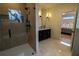 Modern bathroom featuring a sleek double vanity, glass shower, and stylish fixtures at 1122 Rice Nw St, Atlanta, GA 30318
