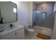 Modern bathroom with gray subway tile shower and glass door and white vanity at 1122 Rice Nw St, Atlanta, GA 30318