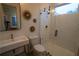 Modern bathroom featuring a glass-enclosed shower, sleek vanity, and stylish tile floors and wall decor at 1122 Rice Nw St, Atlanta, GA 30318
