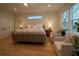 Bright bedroom with a plush bed, hardwood floors, and cozy armchairs at 1122 Rice Nw St, Atlanta, GA 30318