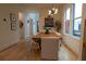Bright dining area with hardwood floors, modern lighting fixture, and large windows at 1122 Rice Nw St, Atlanta, GA 30318