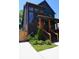 Stunning two-story home showcases a blend of dark brick, modern design, and a beautifully landscaped yard at 1122 Rice Nw St, Atlanta, GA 30318
