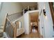 Bright and airy foyer featuring hardwood floors, staircase with iron railing and view to living room at 1122 Rice Nw St, Atlanta, GA 30318