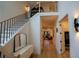 Open hallway with staircase and entry view of the living room, featuring modern lighting at 1122 Rice Nw St, Atlanta, GA 30318
