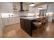 Modern kitchen with a central island, stainless steel appliances, and stylish cabinetry at 1122 Rice Nw St, Atlanta, GA 30318