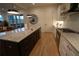 Elegant kitchen features a center island, stainless appliances, modern lighting and hardwood floors at 1122 Rice Nw St, Atlanta, GA 30318