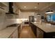 Spacious kitchen with stainless steel appliances, a large island, and open layout to the dining area at 1122 Rice Nw St, Atlanta, GA 30318