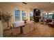 Open-concept living and dining area with a modern fireplace, hardwood floors, and lots of natural light at 1122 Rice Nw St, Atlanta, GA 30318