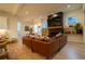 Open-concept living area with hardwood floors, a fireplace, and seamless flow to the dining and kitchen areas at 1122 Rice Nw St, Atlanta, GA 30318