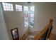 Entry with staircase featuring high ceilings, large windows, and natural light at 1122 Rice Nw St, Atlanta, GA 30318