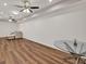 Finished basement with wood flooring, modern ceiling fans and recessed lighting at 1547 Trilogy Park, Hoschton, GA 30548