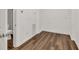 Unfinished basement room with wood-look flooring provides a flexible space for a variety of uses and future expansion at 1547 Trilogy Park, Hoschton, GA 30548