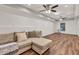 Finished basement with wood flooring, neutral walls and ceiling fans at 1547 Trilogy Park, Hoschton, GA 30548
