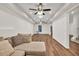 Spacious finished basement with wood flooring, neutral walls, and ceiling fans at 1547 Trilogy Park, Hoschton, GA 30548