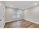Bedroom with hardwood floors and natural light at 1547 Trilogy Park, Hoschton, GA 30548