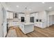 Beautiful kitchen with large island and stainless steel appliances at 1547 Trilogy Park, Hoschton, GA 30548
