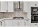 Close up of kitchen with gas cooktop and stainless steel appliances at 1547 Trilogy Park, Hoschton, GA 30548