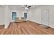 Spacious living room featuring wood-look floors and natural light at 1547 Trilogy Park, Hoschton, GA 30548