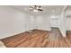 Living room featuring hardwood floors, neutral walls, and a ceiling fan at 1547 Trilogy Park, Hoschton, GA 30548