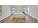 Bright main bedroom featuring wood flooring and natural light at 1547 Trilogy Park, Hoschton, GA 30548