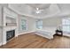 Spacious main bedroom with hardwood floors, tray ceilings, and fireplace at 1547 Trilogy Park, Hoschton, GA 30548
