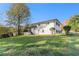 Spacious backyard featuring a well-maintained lawn and the exterior of a beautiful two-story home at 2178 Shamrock Dr, Decatur, GA 30032