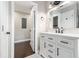 Bathroom with white vanity, marble countertop, and modern black hardware at 2178 Shamrock Dr, Decatur, GA 30032