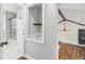 Bathroom featuring shower, storage space and easy access to other spaces in the home at 2178 Shamrock Dr, Decatur, GA 30032