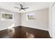 Bright bedroom featuring neutral walls, dark wood floors, and windows providing abundant natural light at 2178 Shamrock Dr, Decatur, GA 30032