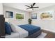 Cozy bedroom with a ceiling fan, two windows offering natural light, and a comfortable bed at 2178 Shamrock Dr, Decatur, GA 30032