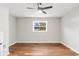 Bedroom with neutral walls, hardwood floors, ceiling fan and a window providing natural light at 2178 Shamrock Dr, Decatur, GA 30032