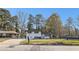 Charming home featuring a manicured lawn, and beautiful contrasting black shutters, all set under a clear blue sky at 2178 Shamrock Dr, Decatur, GA 30032