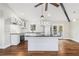Bright kitchen boasts a large center island, stainless steel appliances and stunning hardwood floors at 2178 Shamrock Dr, Decatur, GA 30032