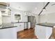 Renovated kitchen features stainless steel appliances, subway tile backsplash and a center island at 2178 Shamrock Dr, Decatur, GA 30032
