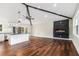 Open concept living and kitchen area with hardwood floors, a fireplace, high ceilings, and natural light at 2178 Shamrock Dr, Decatur, GA 30032
