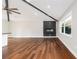 Bright living area featuring hardwood floors, a modern fireplace, high ceilings, and ample natural light at 2178 Shamrock Dr, Decatur, GA 30032